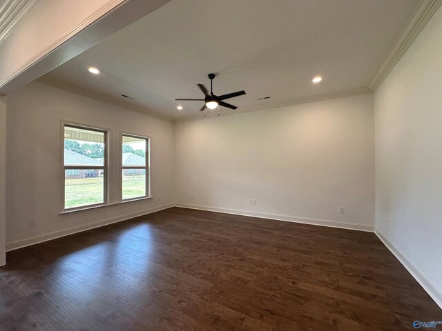 empty room featuring ornamental molding, ceiling fan, and dark wood-type flooring