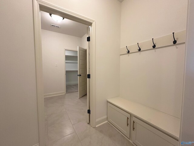 mudroom with light tile patterned floors