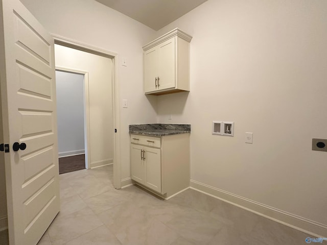 laundry room with light tile patterned flooring, hookup for a washing machine, hookup for an electric dryer, and cabinets