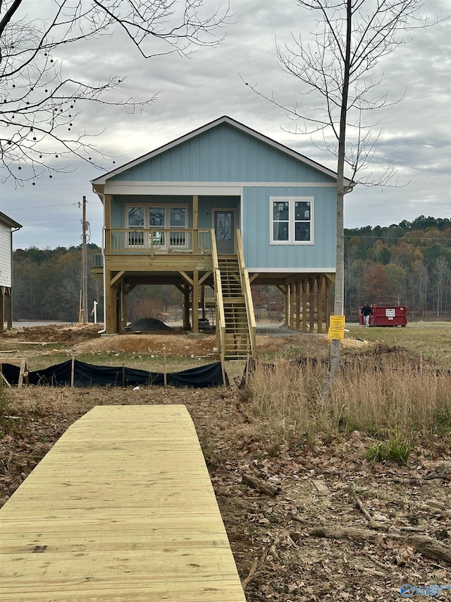 view of front facade with a porch and stairway