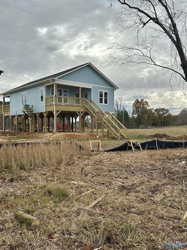 view of front of property featuring stairs