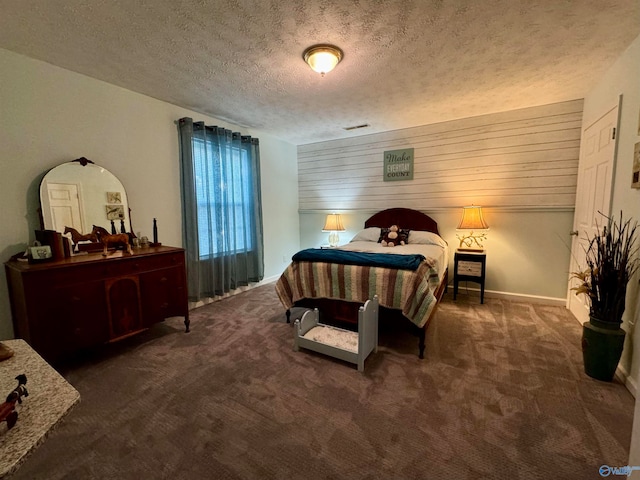 carpeted bedroom with a textured ceiling