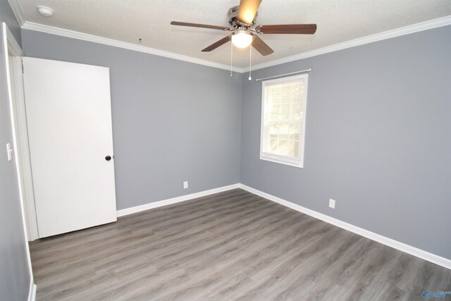 unfurnished room with ceiling fan, ornamental molding, and hardwood / wood-style flooring