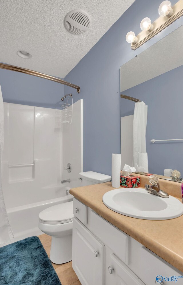 bathroom with visible vents, toilet, shower / tub combo with curtain, a textured ceiling, and vanity