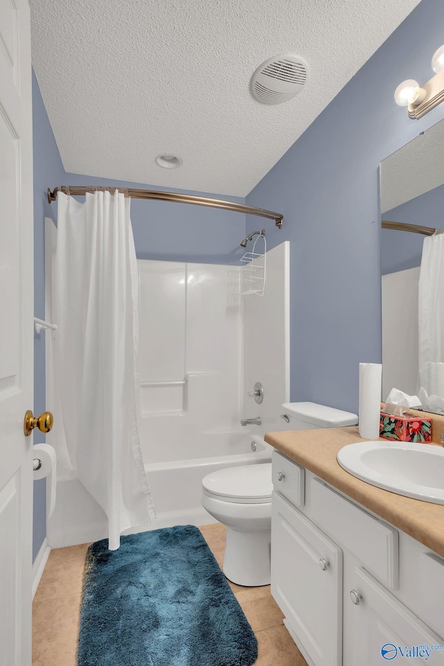 full bathroom with visible vents, shower / bath combo with shower curtain, a textured ceiling, and vanity