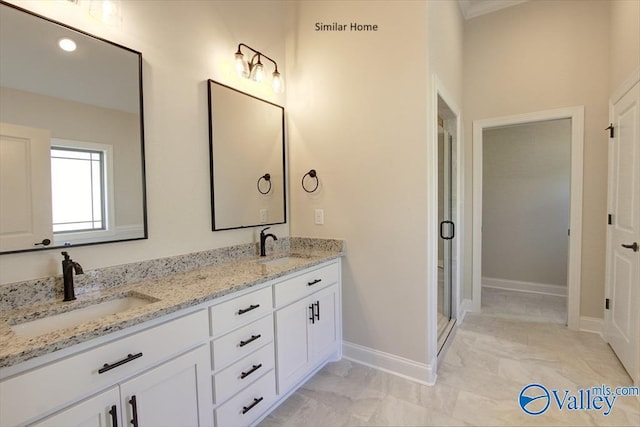 bathroom with vanity and an enclosed shower