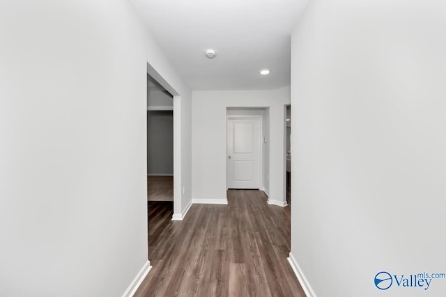 hallway featuring dark wood-type flooring