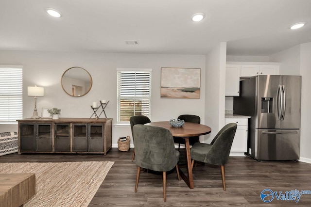 dining room with dark hardwood / wood-style floors