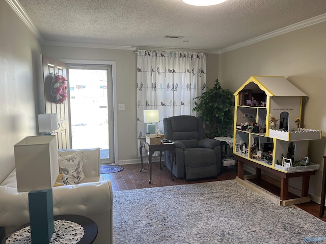 living room with ornamental molding, wood finished floors, and visible vents