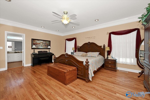bedroom featuring ornamental molding, baseboards, connected bathroom, and light wood-style floors