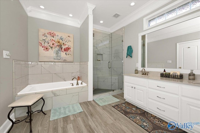 full bath with crown molding, a stall shower, a bath, and wood finished floors