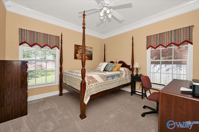 carpeted bedroom with baseboards, visible vents, ornamental molding, and a ceiling fan