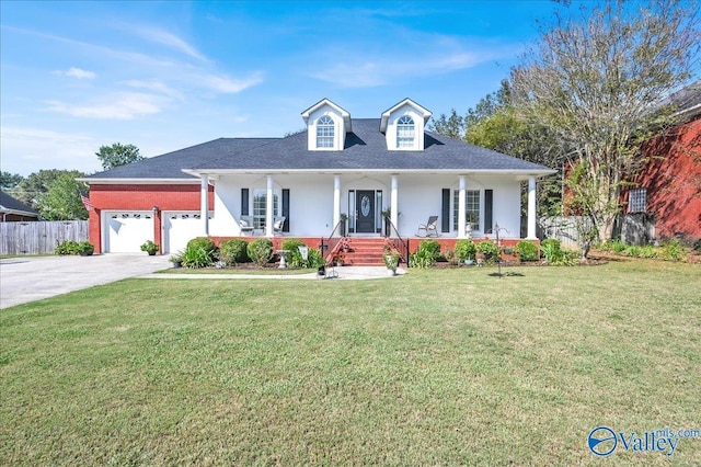 view of front of property featuring concrete driveway, covered porch, fence, a front lawn, and a garage