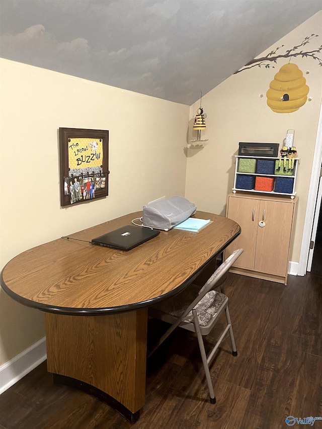 dining space featuring baseboards, lofted ceiling, and dark wood finished floors