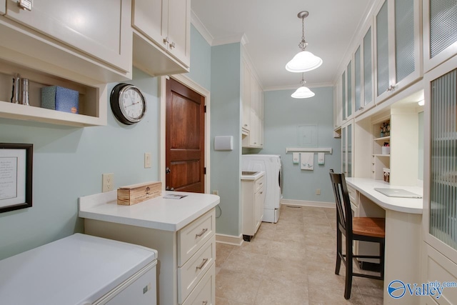 interior space with ornamental molding, cabinets, washer and clothes dryer, and light tile patterned flooring