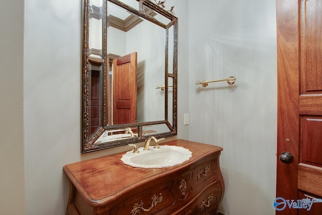 bathroom featuring vanity and ornamental molding