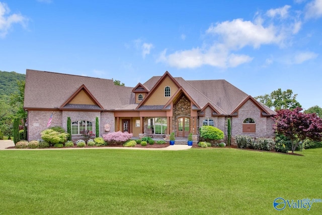 2833 High Mountain Rd NE, Huntsville, AL 35811 - craftsman-style home featuring stone siding and a front lawn