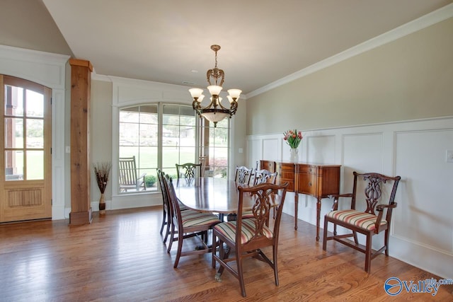 2833 High Mountain Rd NE, Huntsville, AL 35811 - dining area with crown molding, a wealth of natural light, a decorative wall, and a chandelier