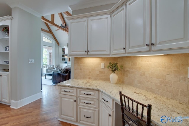 2833 High Mountain Rd NE, Huntsville, AL 35811 - kitchen with ceiling fan, light wood-style flooring, white cabinetry, baseboards, and backsplash