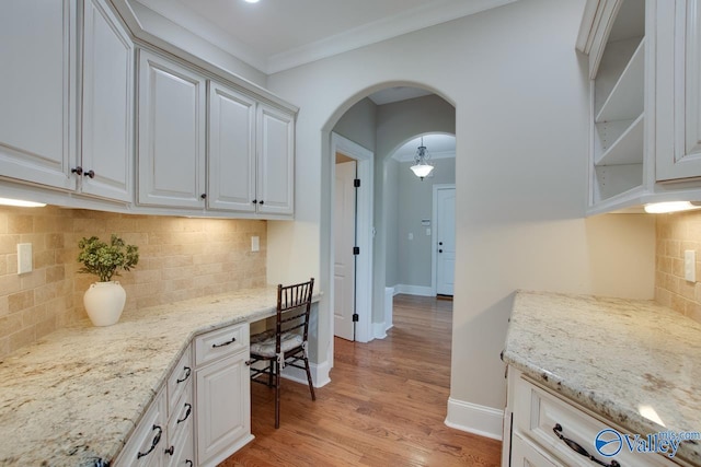 2833 High Mountain Rd NE, Huntsville, AL 35811 - office area with light wood-type flooring, arched walkways, baseboards, and ornamental molding