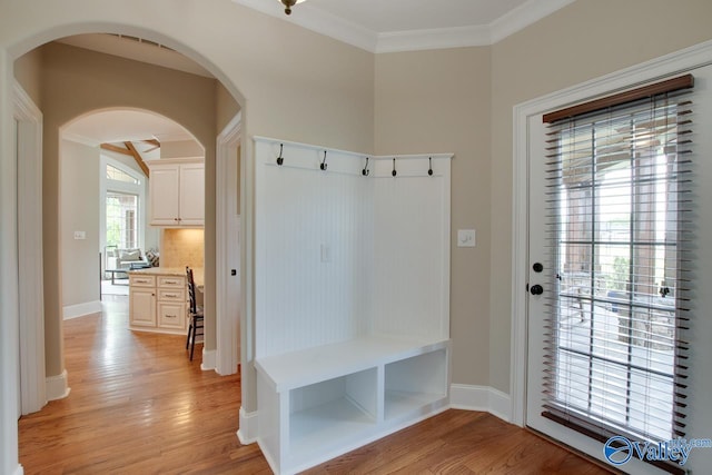 2833 High Mountain Rd NE, Huntsville, AL 35811 - mudroom with arched walkways, ornamental molding, baseboards, and light wood-style flooring