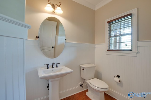 2833 High Mountain Rd NE, Huntsville, AL 35811 - half bathroom with ornamental molding, wainscoting, toilet, and wood finished floors