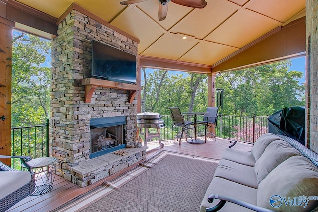 2833 High Mountain Rd NE, Huntsville, AL 35811 - view of patio featuring a ceiling fan, an outdoor living space with a fireplace, outdoor dining area, and a deck