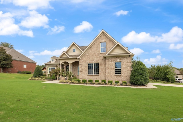 craftsman-style home with a front yard