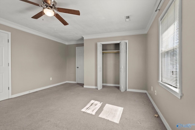 26150 Mooresville Rd, Elkmont, AL 35620 - unfurnished bedroom with baseboards, light carpet, ornamental molding, and a closet