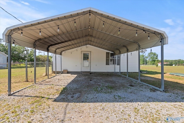 26150 Mooresville Rd, Elkmont, AL 35620 - view of vehicle parking featuring fence and a detached carport