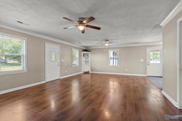26150 Mooresville Rd, Elkmont, AL 35620 - unfurnished living room with ceiling fan, visible vents, crown molding, baseboards, and dark wood-style floors