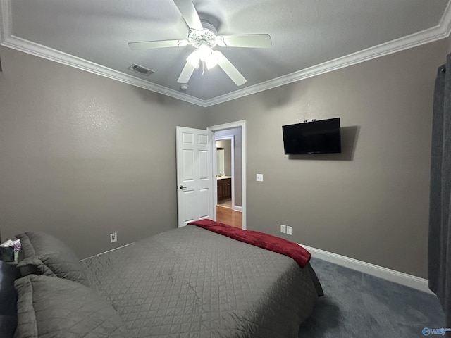 carpeted bedroom with ceiling fan, ornamental molding, visible vents, and baseboards