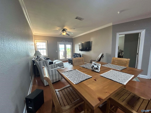 dining room with ornamental molding, french doors, and ceiling fan