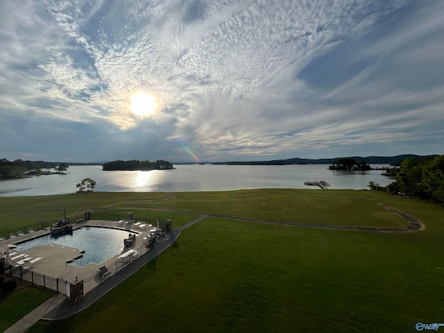 aerial view at dusk with a water view