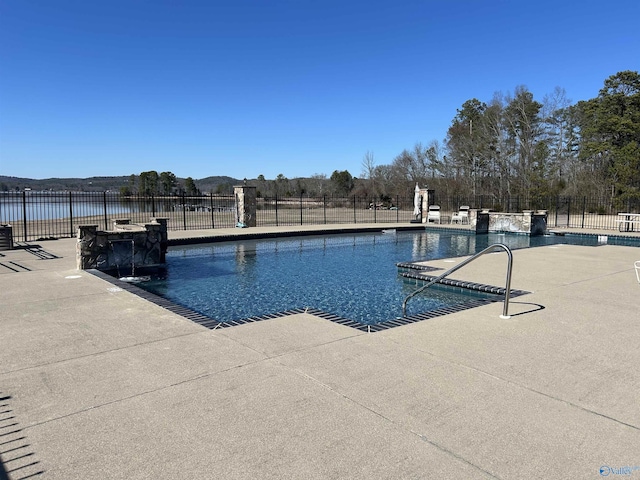 pool featuring a patio area and fence