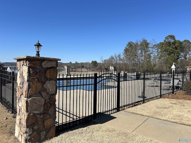 view of gate featuring fence