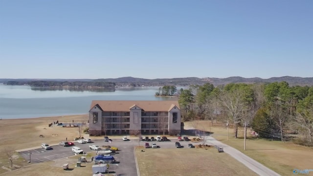 birds eye view of property featuring a water and mountain view