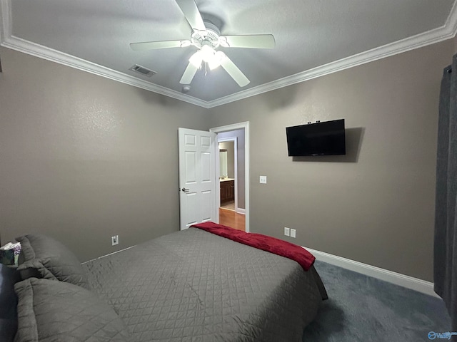 carpeted bedroom with crown molding and ceiling fan