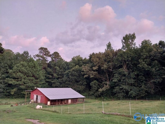 exterior space with an outbuilding and a rural view