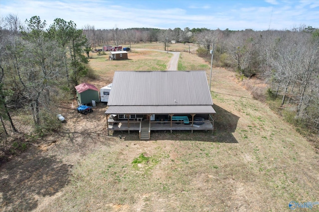 aerial view featuring a view of trees