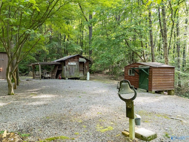136 Higdon Rd, Falkville, AL 35622 - view of shed with a view of trees