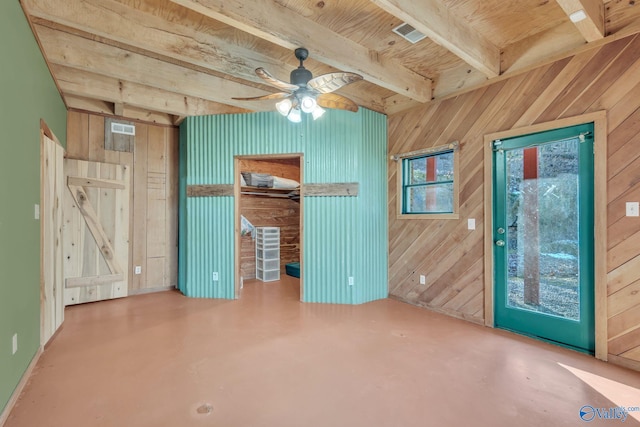 136 Higdon Rd, Falkville, AL 35622 - unfurnished living room featuring wood walls, ceiling fan, concrete floors, and a wood ceiling with exposed beams