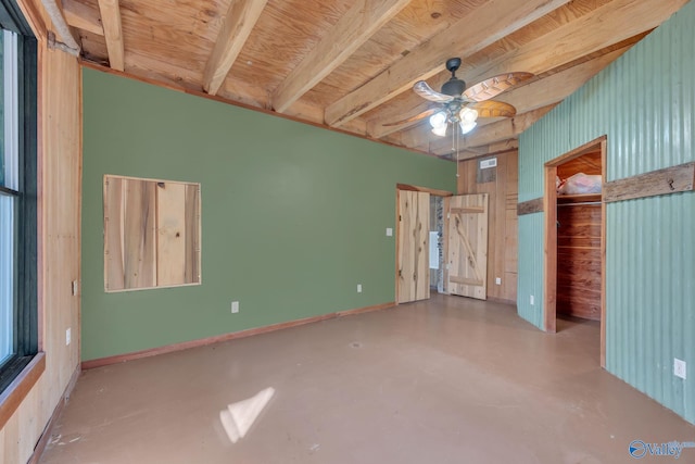 136 Higdon Rd, Falkville, AL 35622 - unfurnished bedroom with concrete flooring, a spacious closet, a closet, and ceiling fan