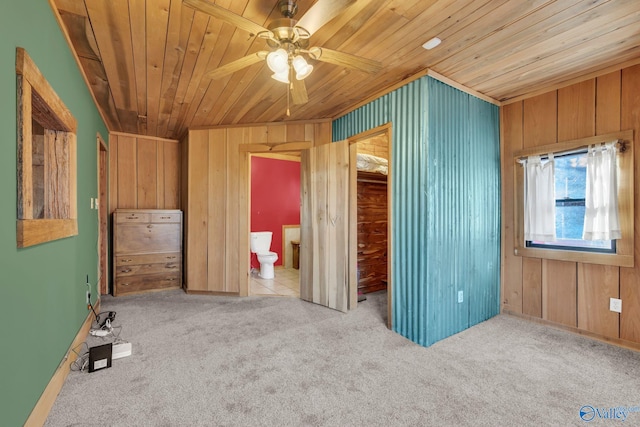 136 Higdon Rd, Falkville, AL 35622 - unfurnished bedroom with wooden ceiling, carpet, wooden walls, and connected bathroom