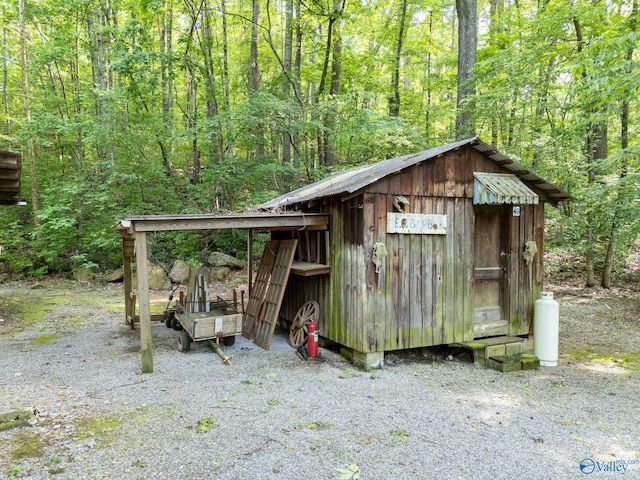 136 Higdon Rd, Falkville, AL 35622 - view of outbuilding featuring a view of trees