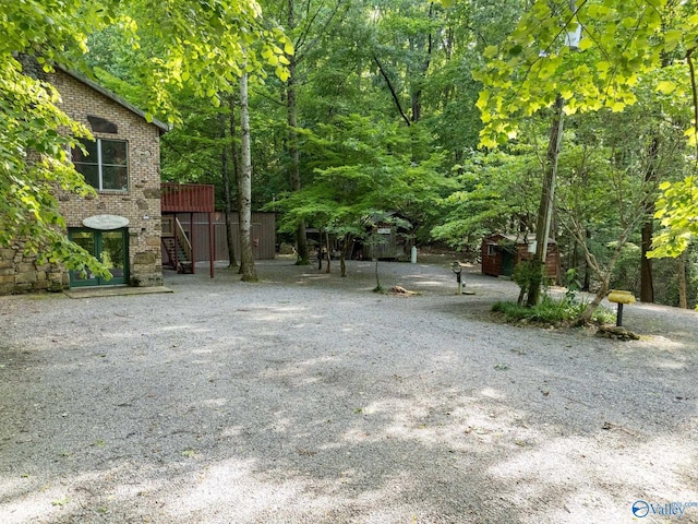 136 Higdon Rd, Falkville, AL 35622 - view of yard featuring stairway and a wooden deck