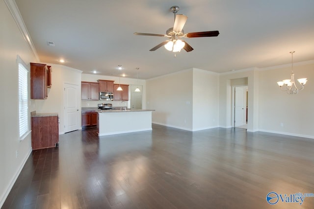 unfurnished living room featuring a healthy amount of sunlight, ceiling fan with notable chandelier, dark wood-type flooring, and ornamental molding