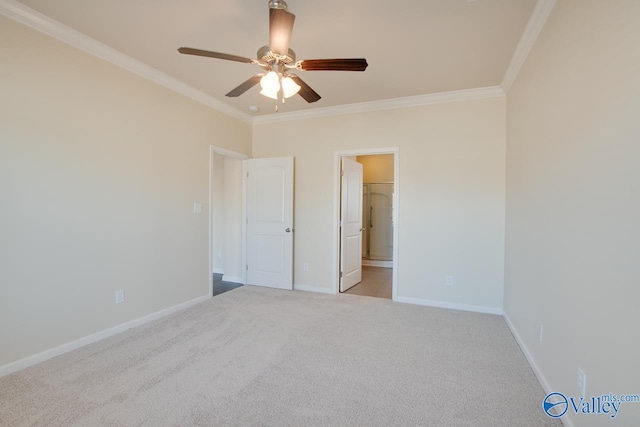 empty room featuring crown molding, ceiling fan, and light carpet