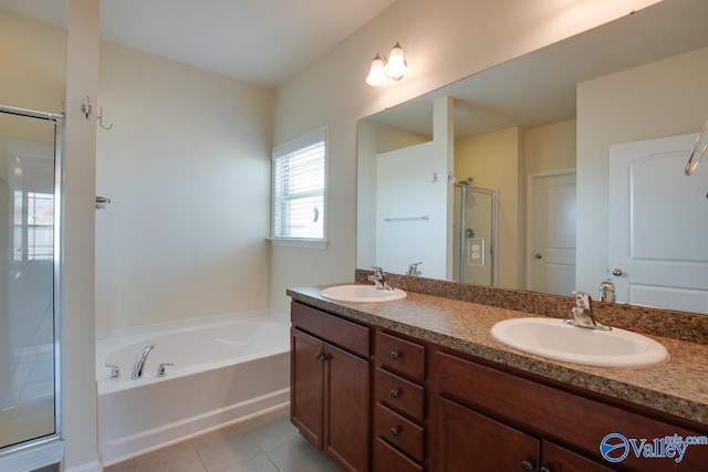 bathroom featuring tile patterned floors, vanity, and plus walk in shower