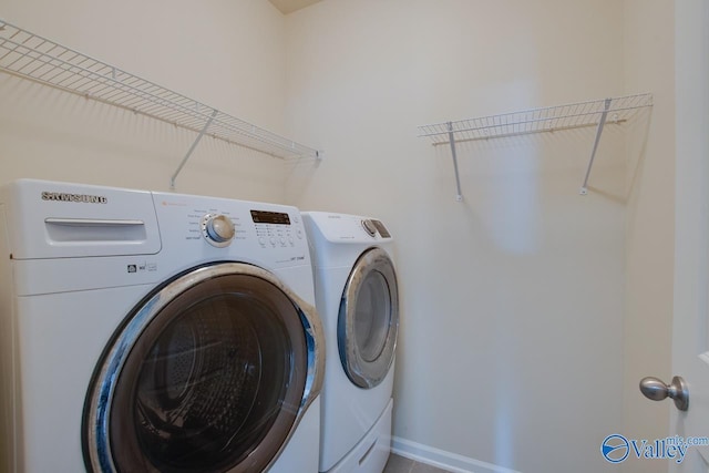 washroom with separate washer and dryer